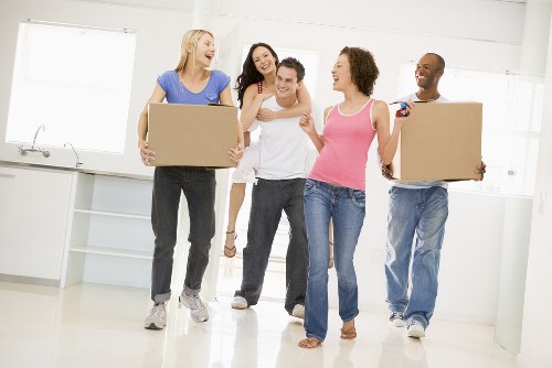 Movers handling a same day apartment removal in Canary Wharf
