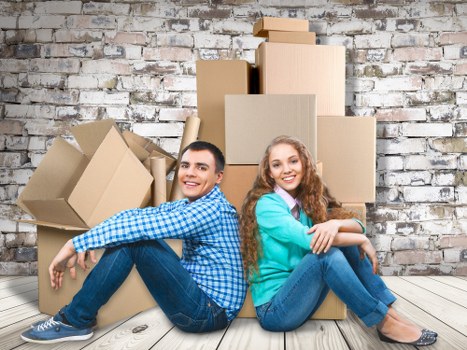 Packed moving boxes and furniture for a local Canary Wharf relocation