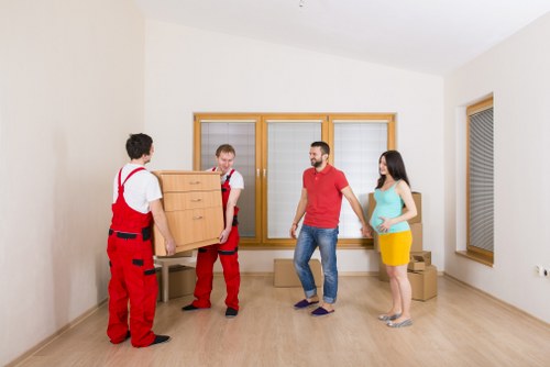 Specialist movers managing a piano relocation near Canary Wharf access routes