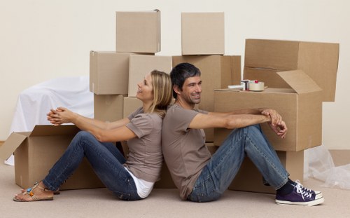 Packed boxes and moving van for a Canary Wharf relocation