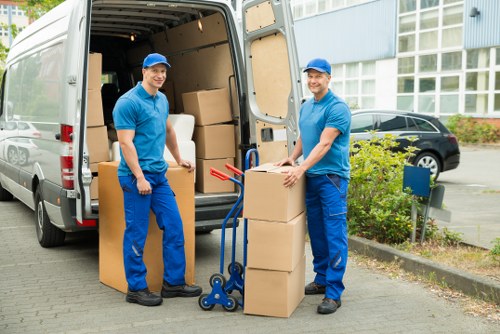 Business move team handling office furniture and equipment near Canary Wharf