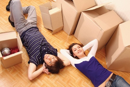 Furniture being carefully moved through a modern Canary Wharf building